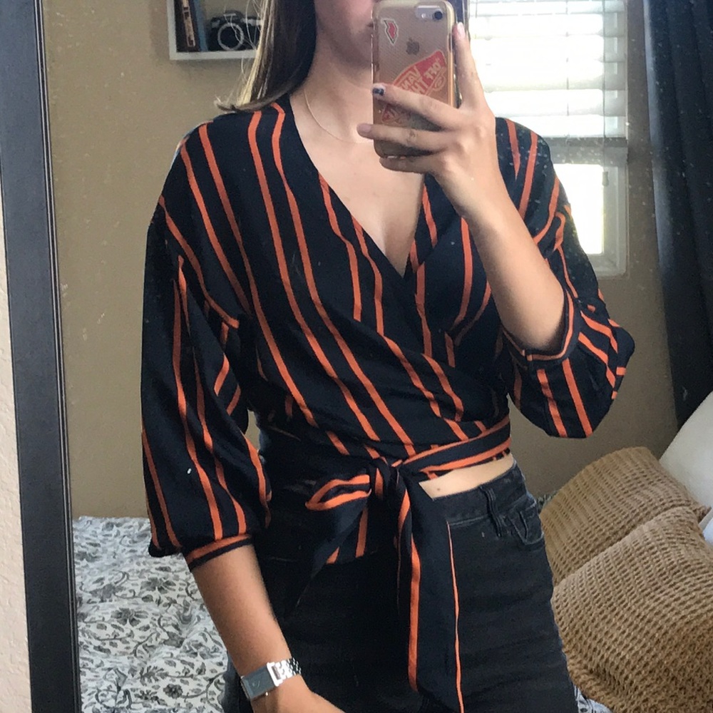 Dark navy and orange wraparound blouse